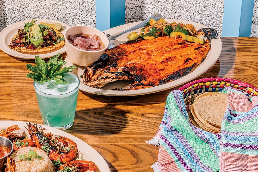 From top: Tostada de atún, pescado zarandeado, Blue Sky daiquiri, and camarónes borrachos at Big Star Mariscos