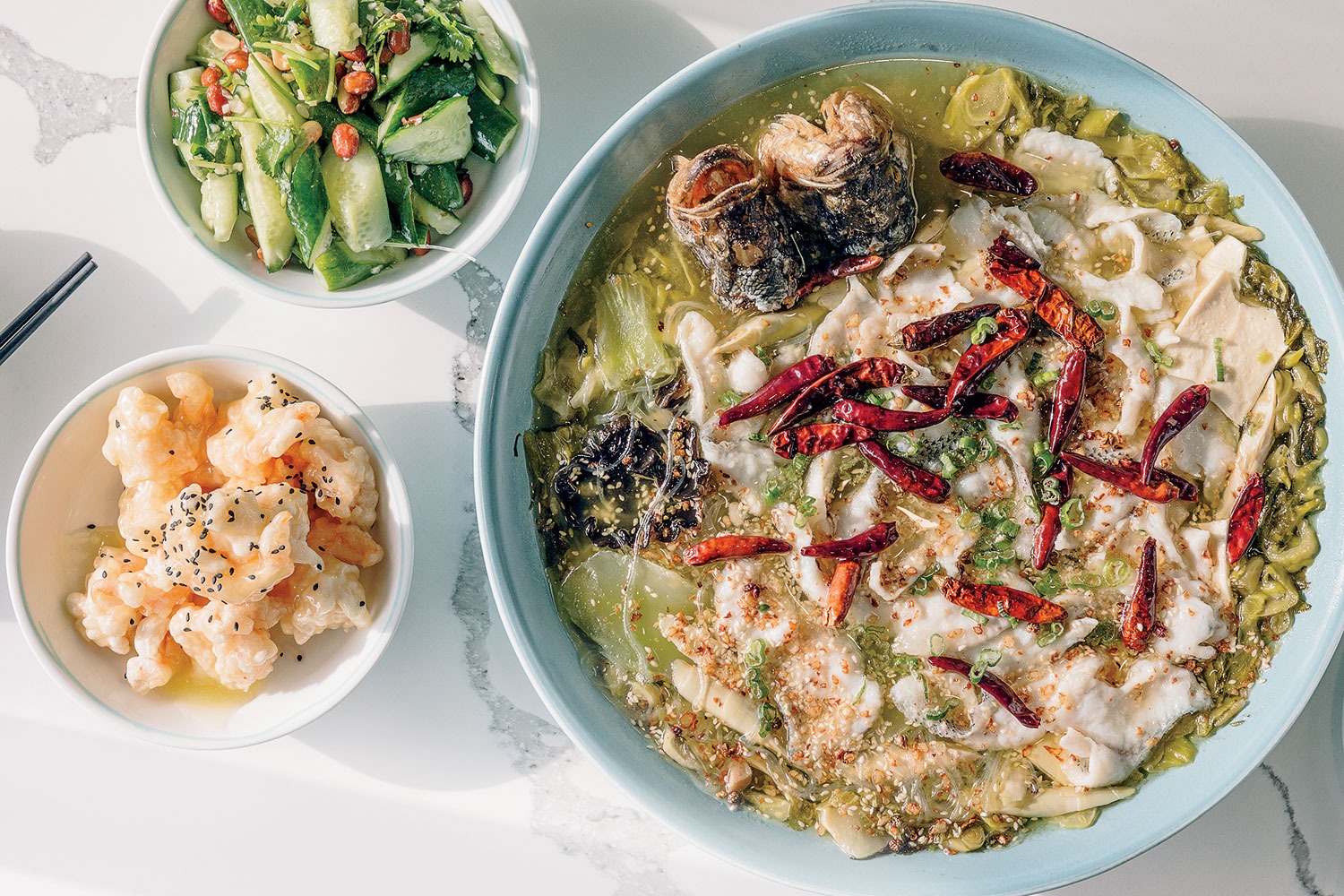 Pickled fish hot pot with shrimp and cucumbers