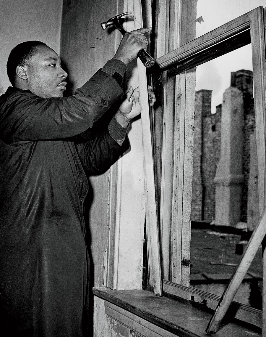 Martin Luther King Jr. making repairs in an apartment.