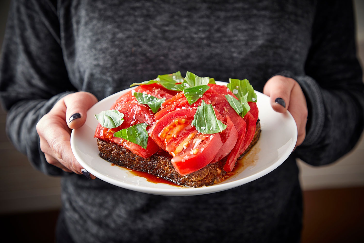 "The Overpriced Tomato" at Daisies — an open-faced tartine of summer tomatoes seasoned with "cheap balsamic" and molten bone marrow — is one of the glories of Chicago dining.