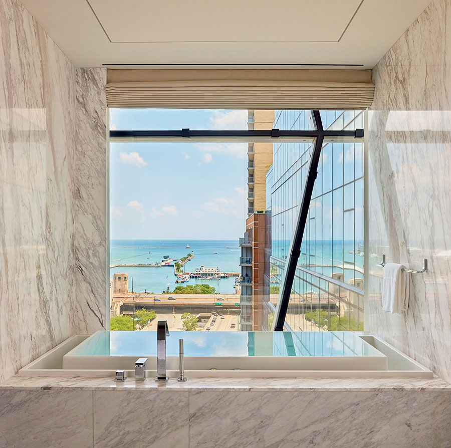 An effervescent infinity tub in The St. Regis Presidential Suite