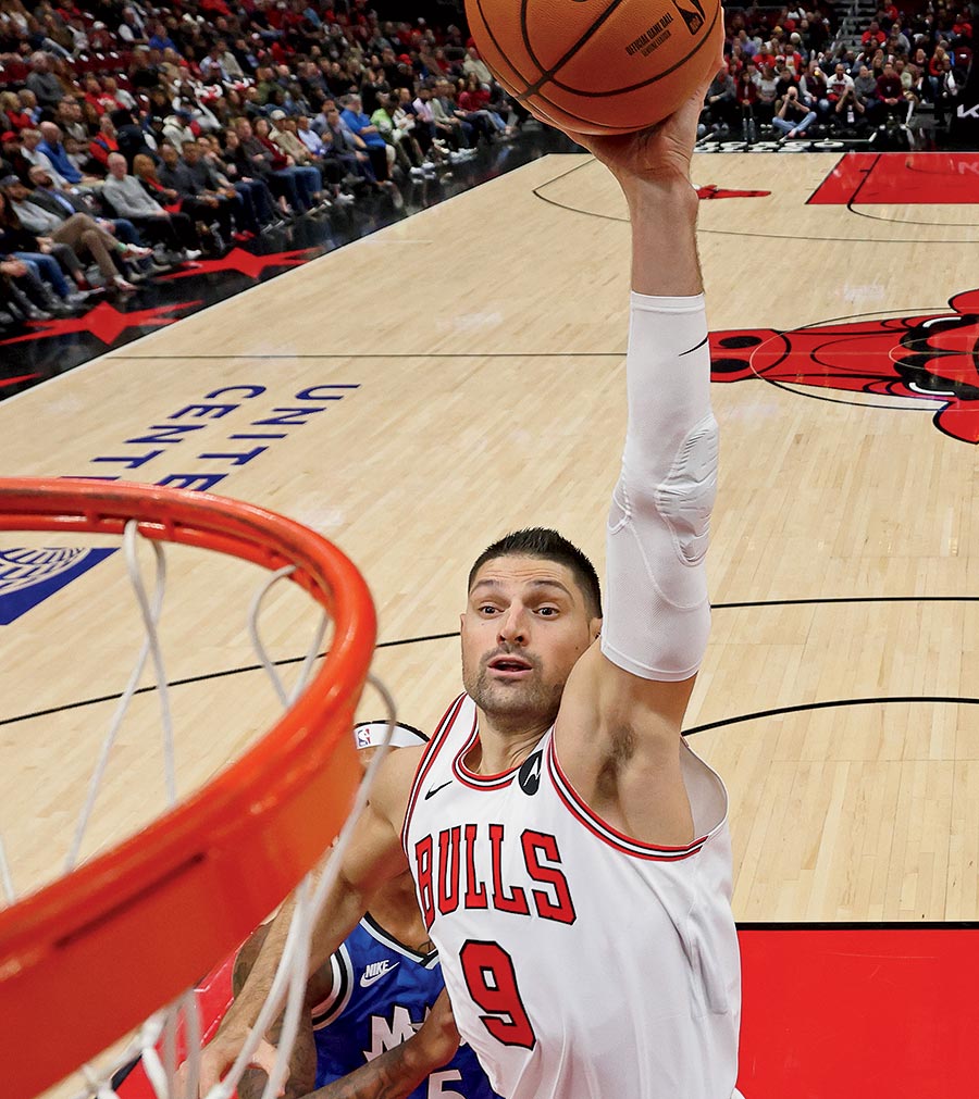 Nikola Vučević about to score a basket.