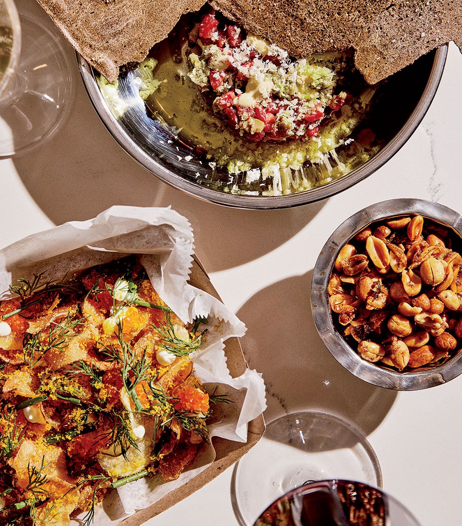 Steak tartare, spicy fried peanuts, and disco chips