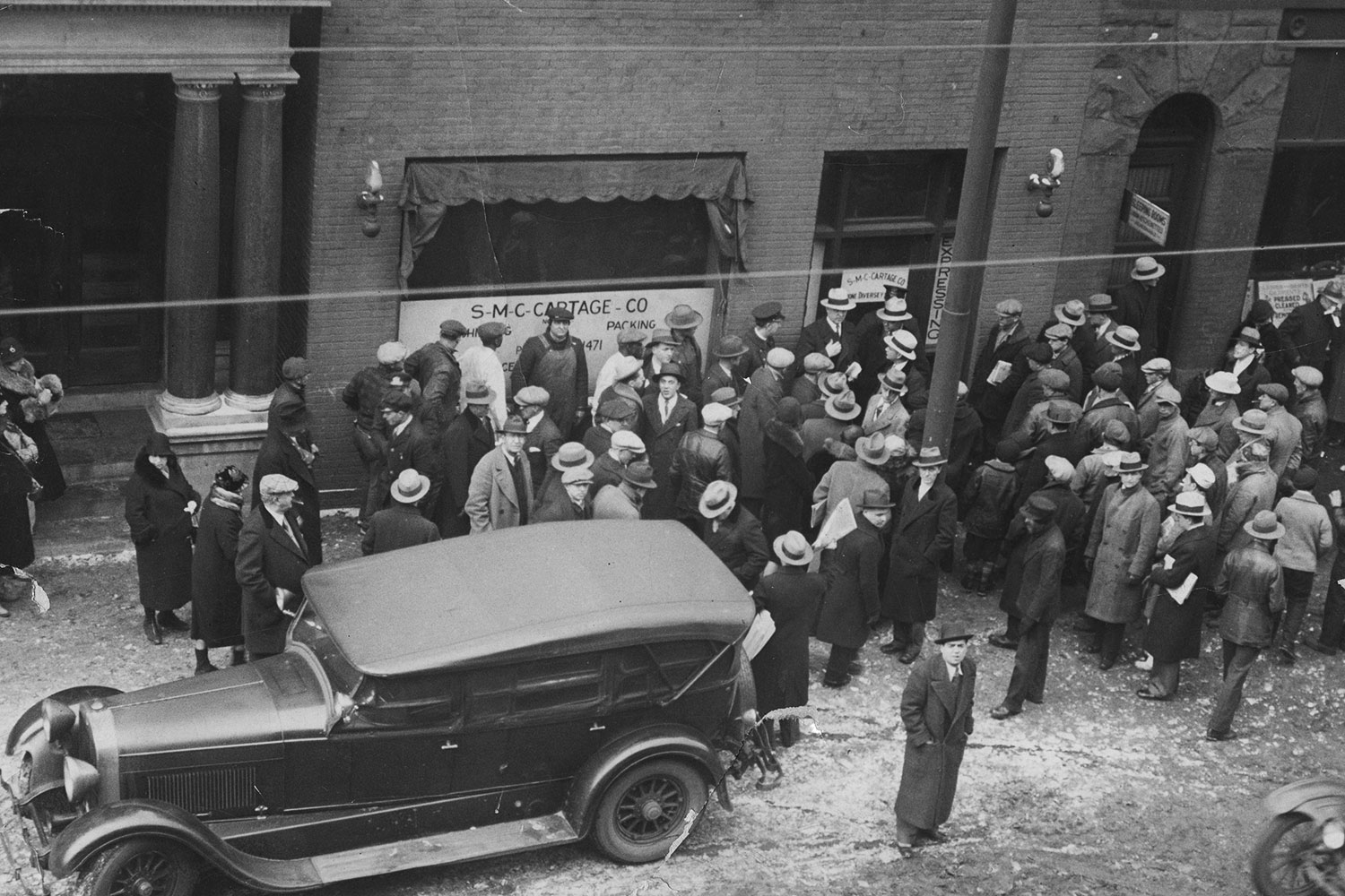 A crowd outside the Clark Street garage, owned by George “Bugs” Moran, where the St. Valentine’s Day massacre took place.