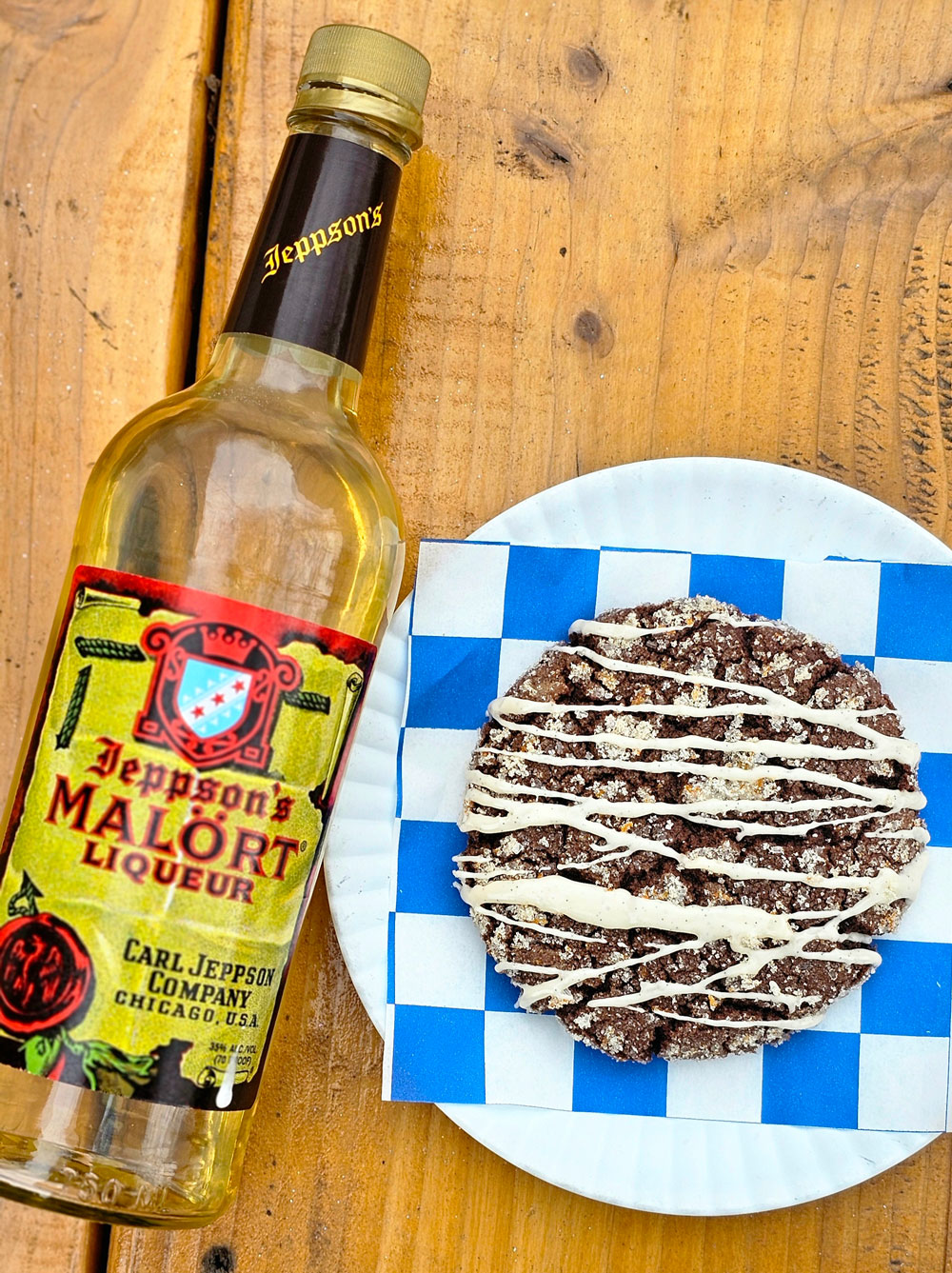 A bottle of Malört next to a Malört cookie