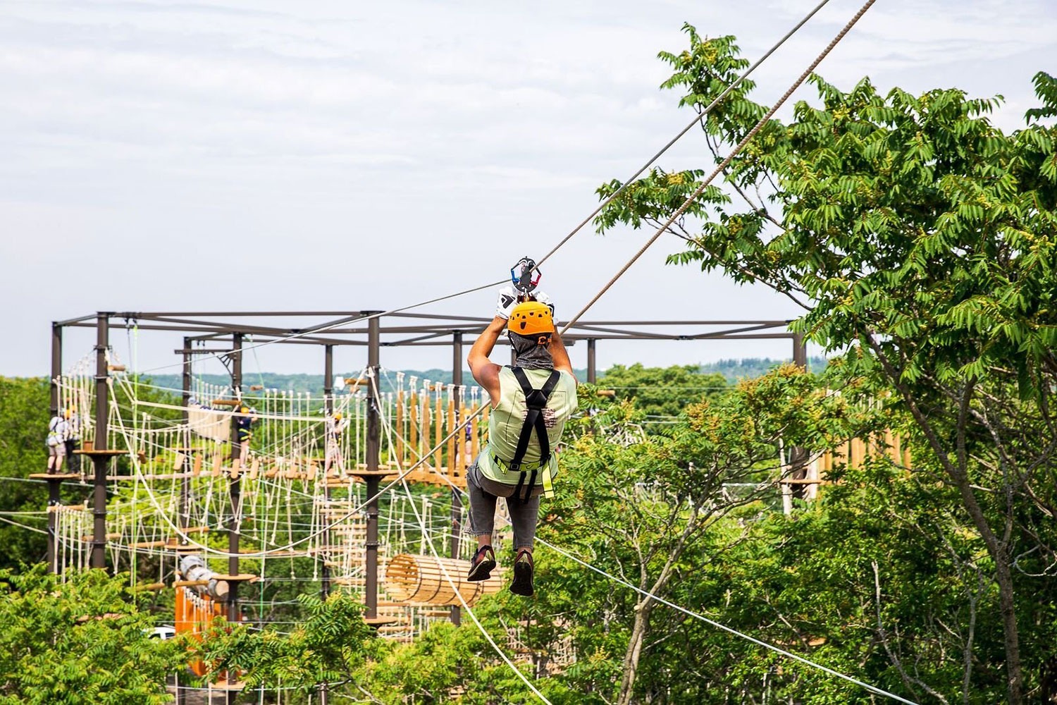 A person ziplining at The Forge: Lemont Quarries