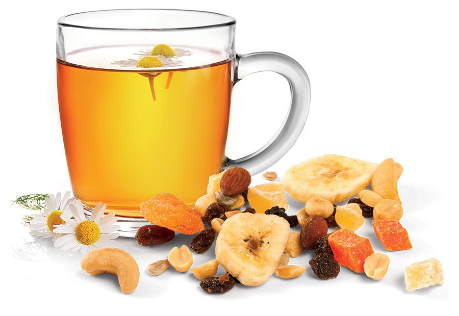A clear mug full of tea and trail mix