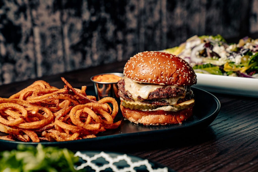 A cheeseburger and fries from Wolf & Company
