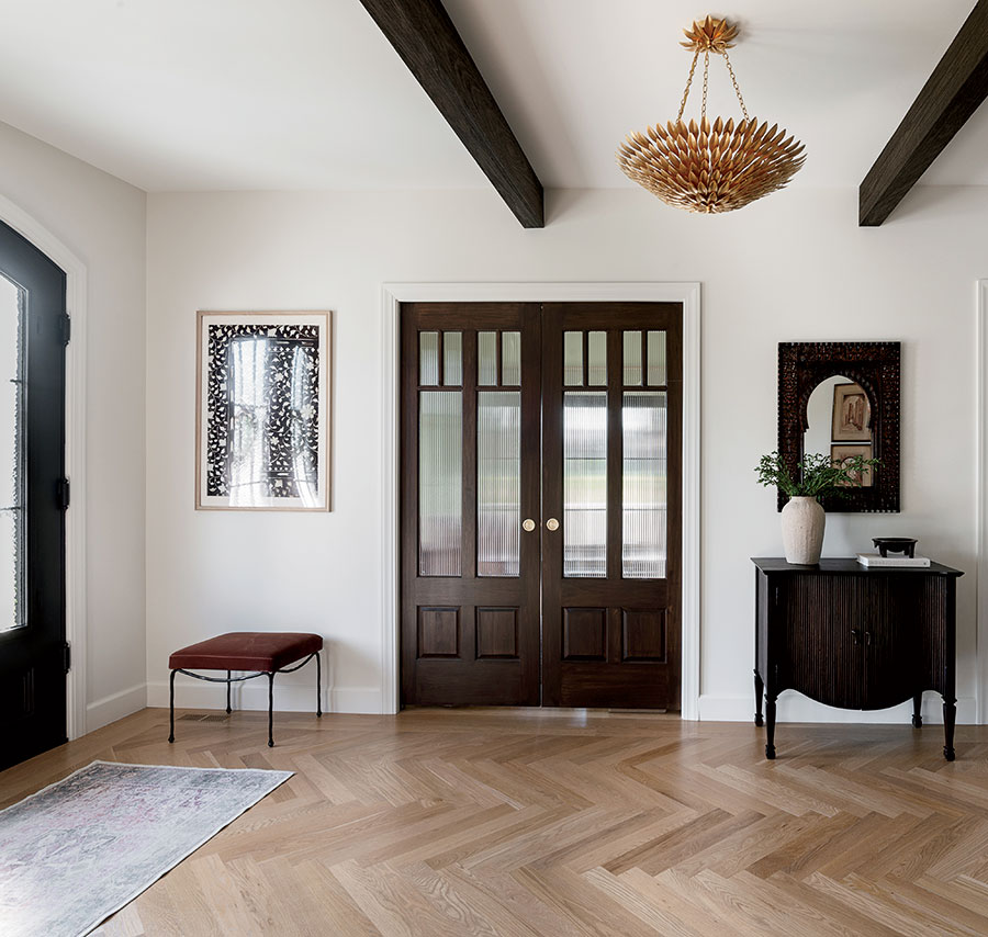 Traditional Palestinian design elements are tapped in the entryway, like the dome shapes (seen in the mirror and side table) and natural walnut ceiling beams.