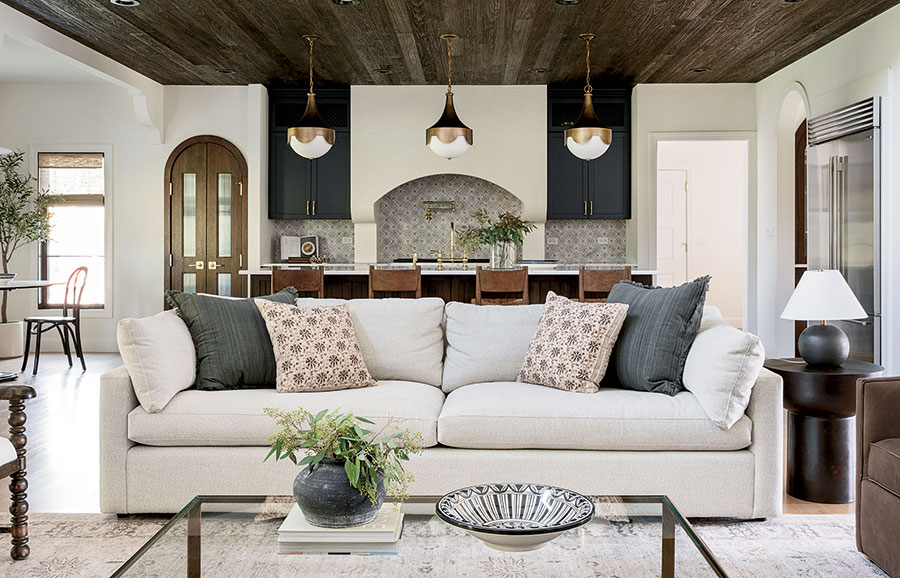 A single ceramic bowl, purchased on a family trip to Jordan and now displayed on the coffee table, influenced key elements in the living room and kitchen. Its patterns and colors inspired the choice of the throw pillows and backsplash tile.