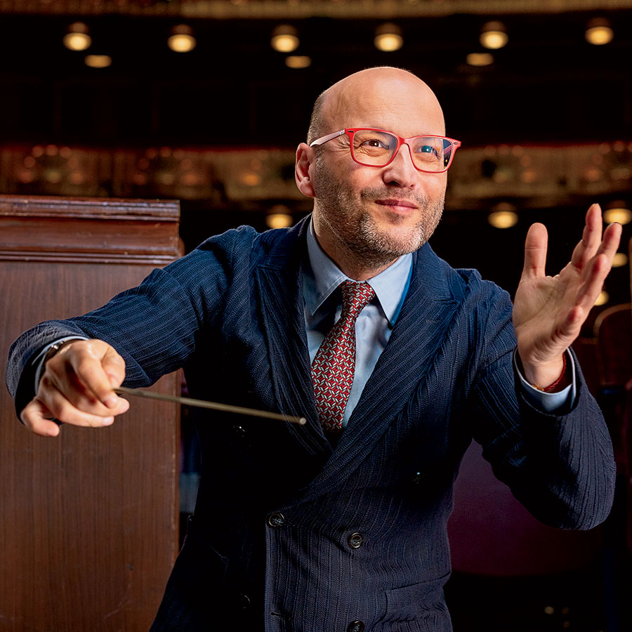 A conductor conducting musicians