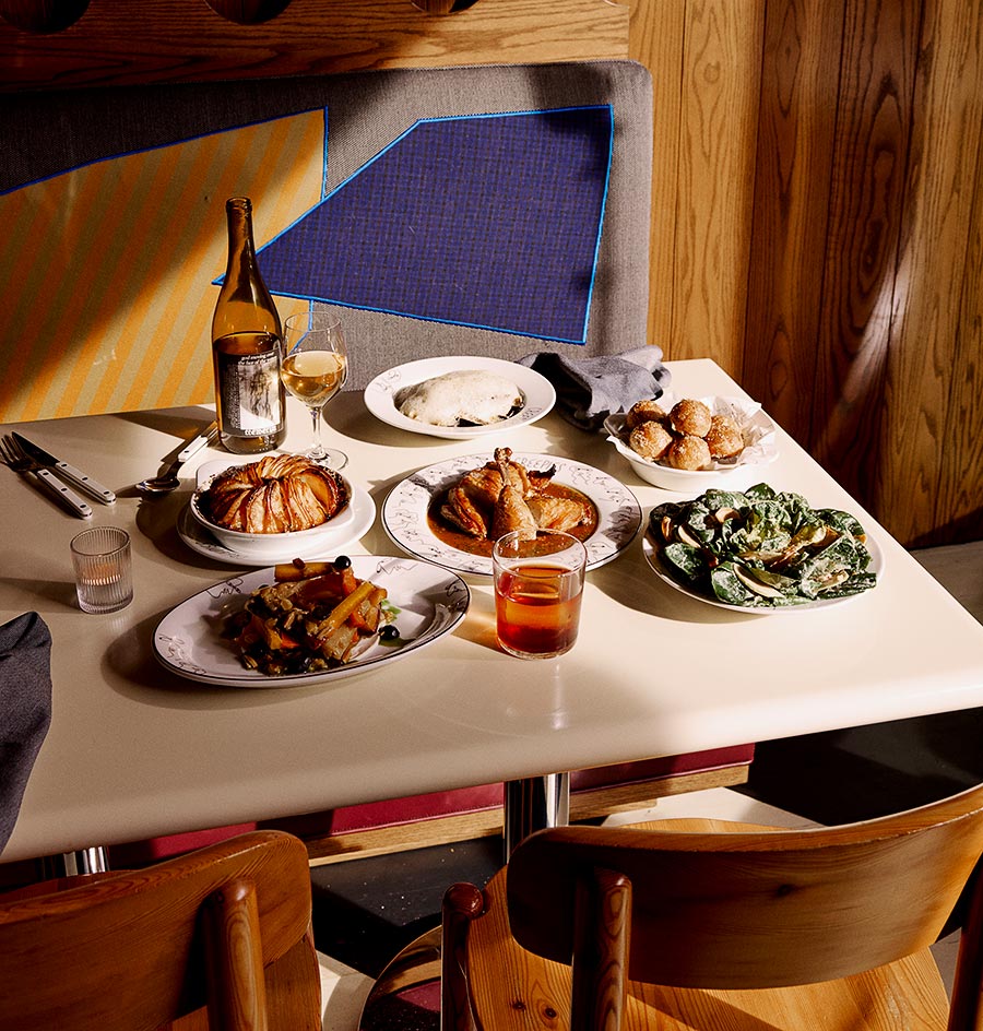 Clockwise, from top left: Ratatouille potatoes, mussels, gougères, Little Gem salad, chicken, carrots