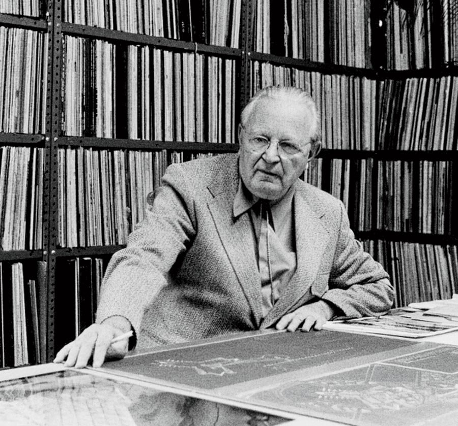 A photo of the architect in his studio in 1973, surrounded by his record collection