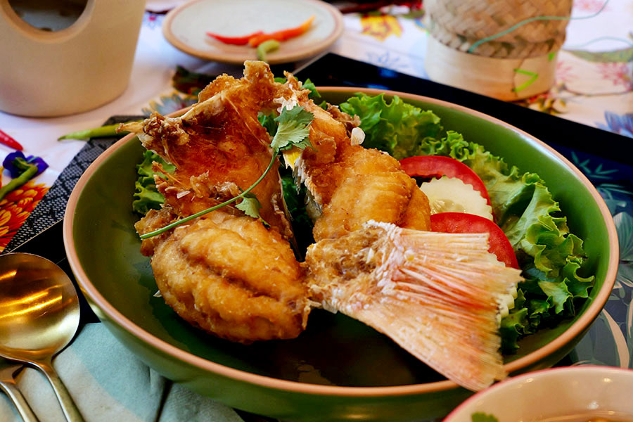 Fried fish on a plate at Tuk Tuk Thai Isan Street Food