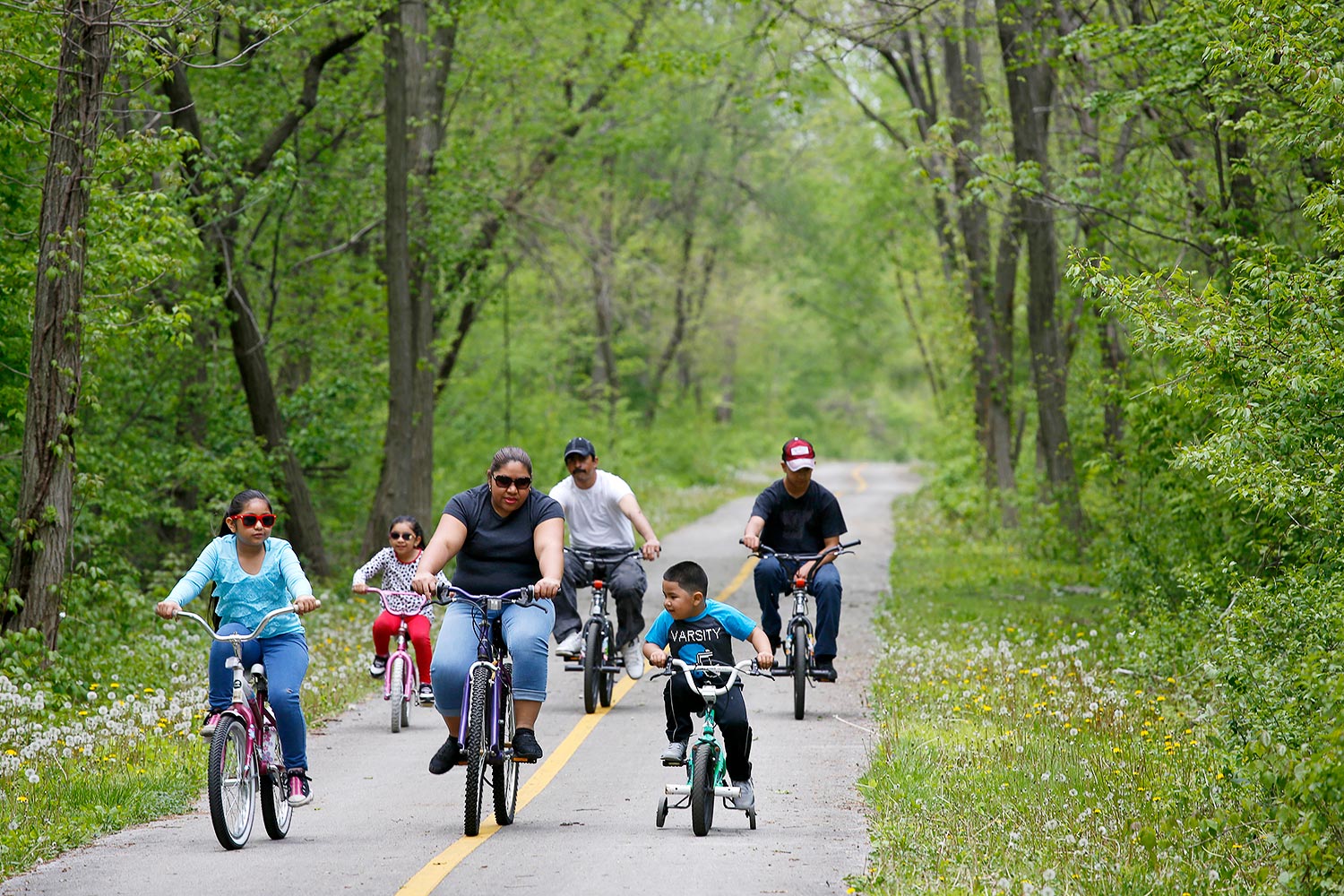 A family rides on the Major Taylor Bike Trail near 87th Street and Western Avenue.