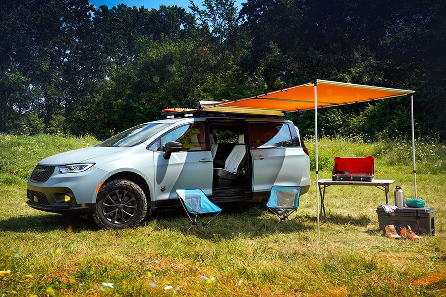 The Chrysler Pacifica Grizzly Peak with its canopy open in a field