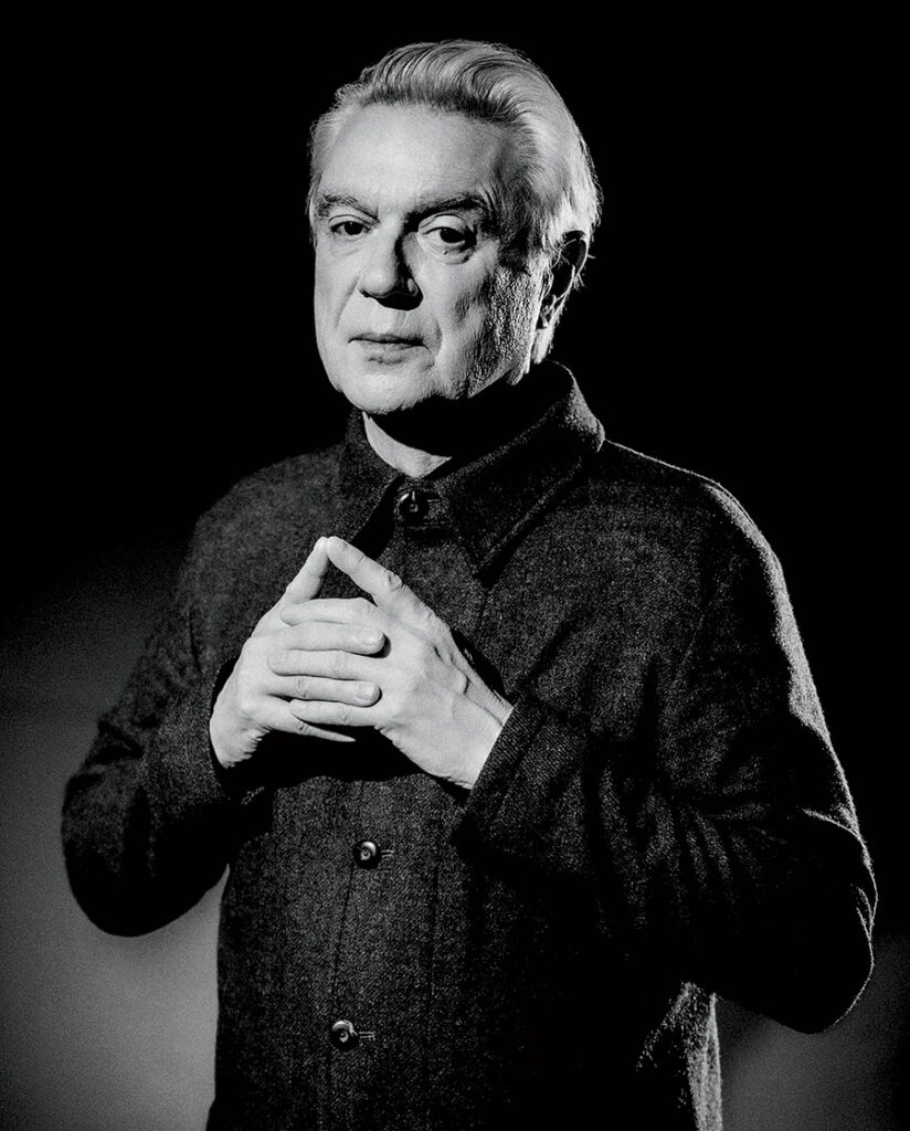 A black and white portrait of David Byrne