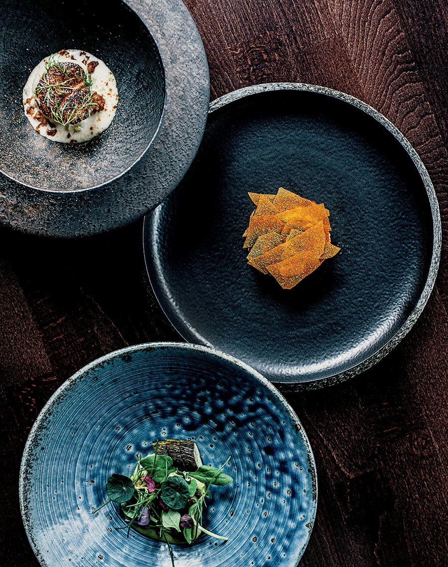 From top: Scallop, foie gras canelé, sablefish