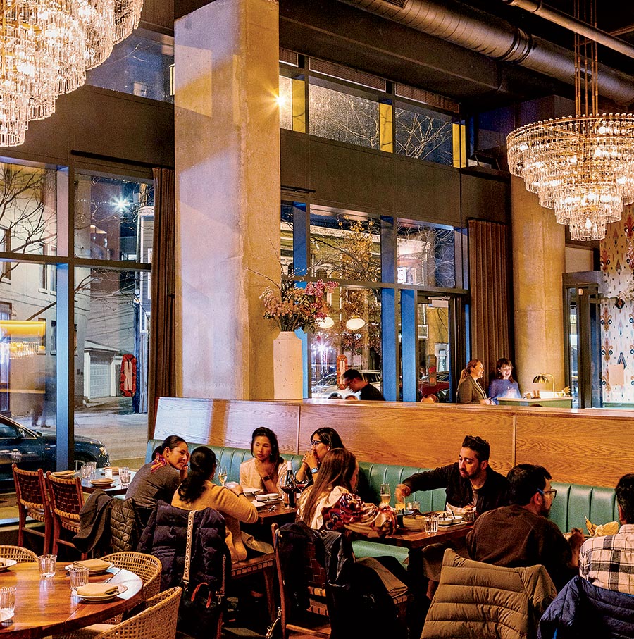 Diners enjoying a meal in the dining area inside Nadu