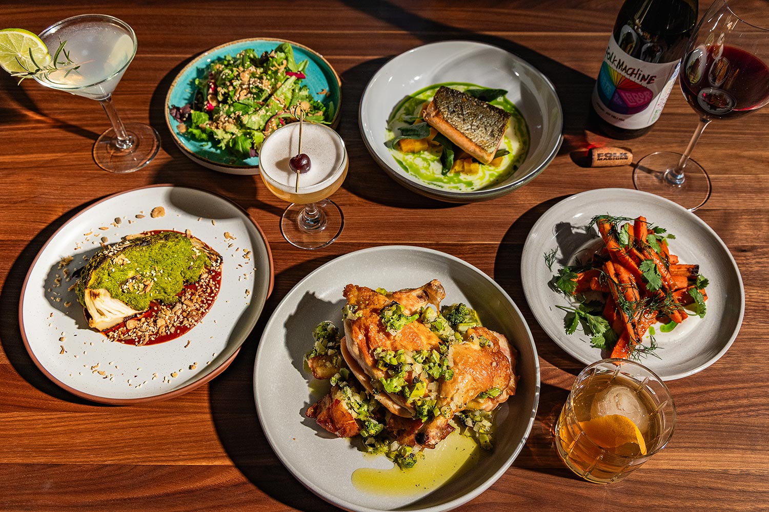 Various dishes displayed on a table at Burl