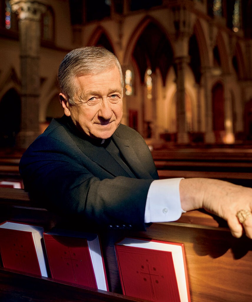 Cardinal Blase Cupich sitting in a church pew