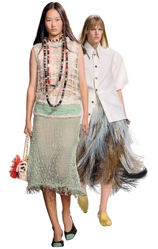 Far left: Chanel viscose knit and cotton top, knit skirt, and resin, strass, and metal necklace. Right: Bottega Veneta fiber and leather skirt