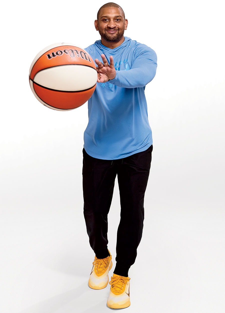 Tyler Marsh tossing a WNBA basketball