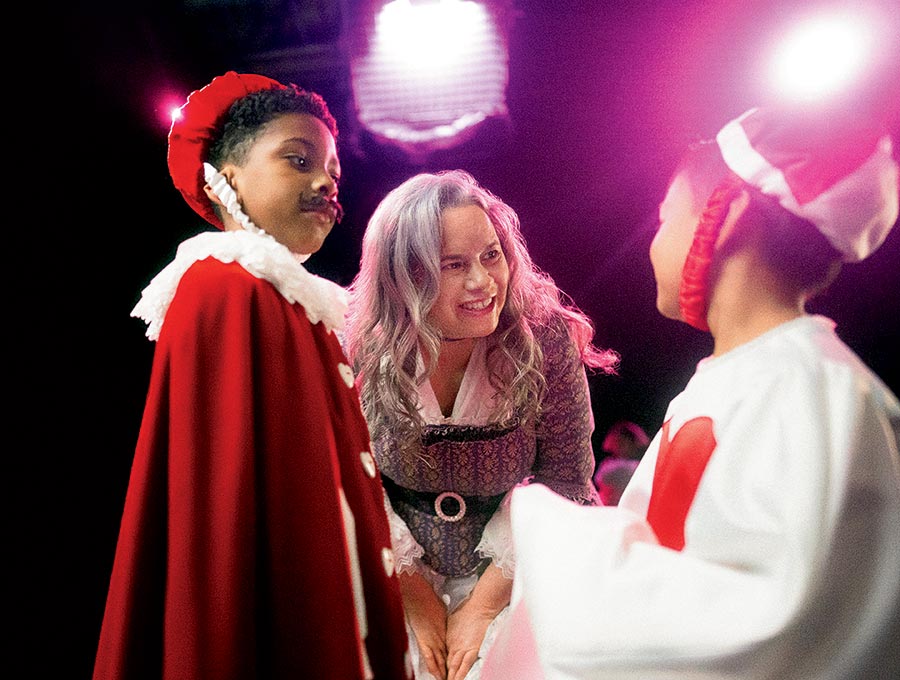 Natalie Merchant smiling at two kids in costumes