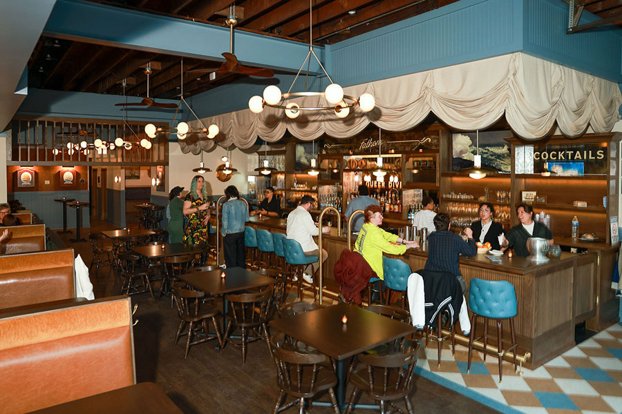 Patrons sitting at the bar at Fathom